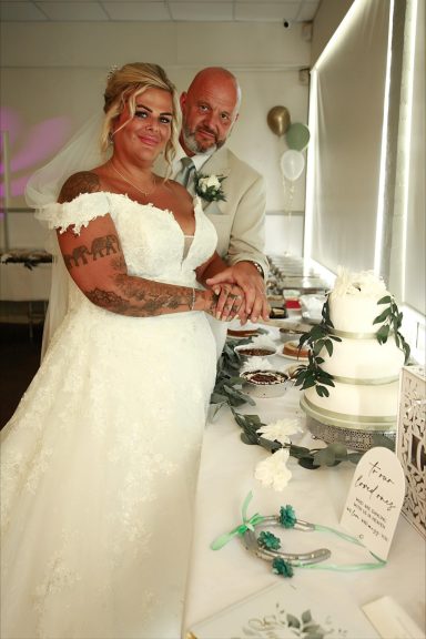 Bride & Groom Cutting The Cake Wednesbury Rugby Club Photographed by Wolverhampton wedding photographer Sarah Ratcliffe