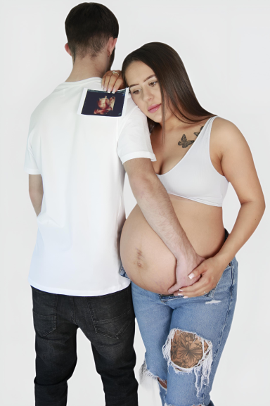 Expectant parents with scan photo maternity photoshoot. 