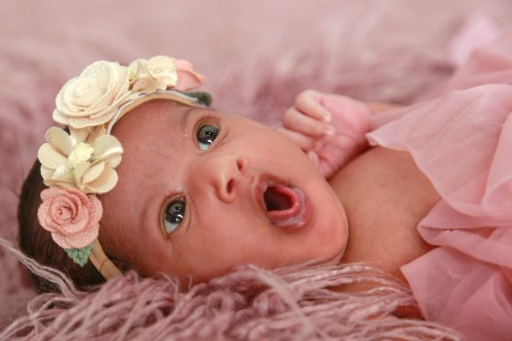 Newborn photography baby yawning