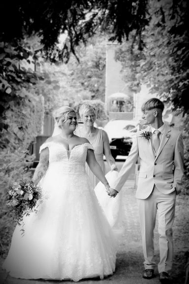 Bride and son arriving at All Saints Church Sedgley Photographed by Wolverhampton wedding photographer Sarah Ratcliffe